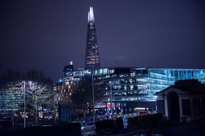 Illuminated buildings in city at night