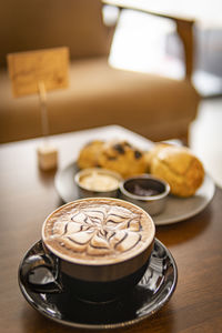 Hot chocolate with blur desert cafe background