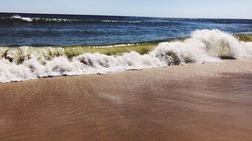 Scenic view of sea against clear sky