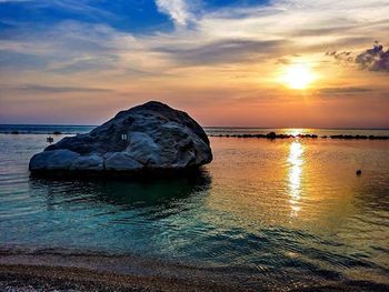 Scenic view of sea at sunset