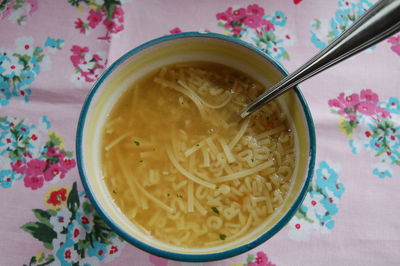 Close-up of noodle soup served on table