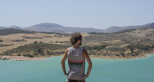 Rear view of man viewing the landscape