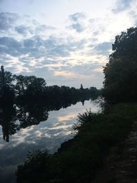 Scenic view of trees against sky during sunset