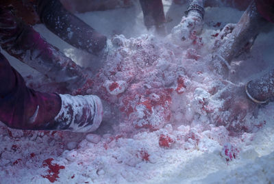 Laborers making gulal to play holi festival of colors, gurgaon, india. 26 march 2021.