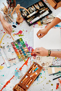 High angle view of people working on table