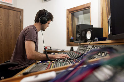 Audio engineer working at an instrument panel