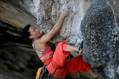 Rear view of man standing on rock