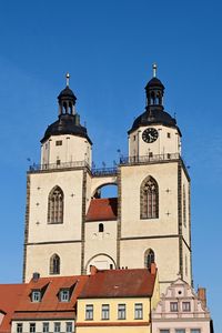 Low angle view of building against clear blue sky