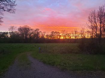 Scenic view of field against sky during sunset