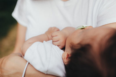 Midsection of couple kissing