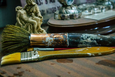 Close-up of buddha statue on table