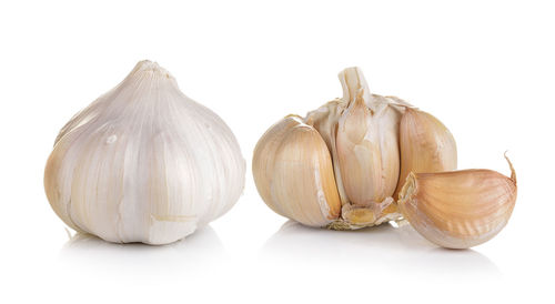 Close-up of garlic against white background