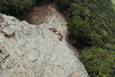 High angle view of people on rock