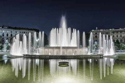 Panoramic view of fountain at night