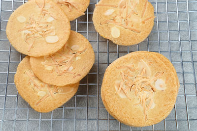 Almond crispy cookies with grated cheese, thin texture