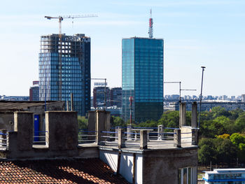 Modern buildings in city against sky