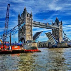 Bridge over river with city in background