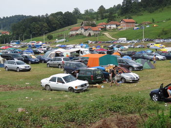 High angle view of cars on field