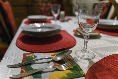 Close-up of wine glasses on table