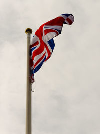 Low angle view of flag against sky