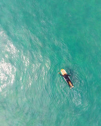 Aerial view of man surfing in sea