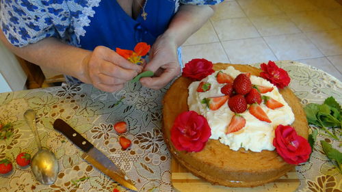 High angle view of woman preparing food on table