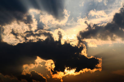 Low angle view of cloudy sky during sunset