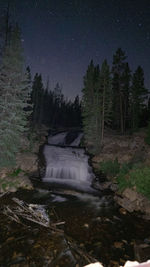 Scenic view of waterfall at night