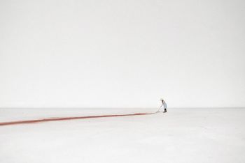 MAN ON SNOW COVERED FIELD