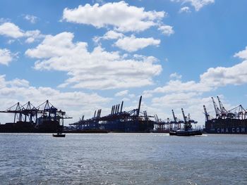 Boats in sea against sky