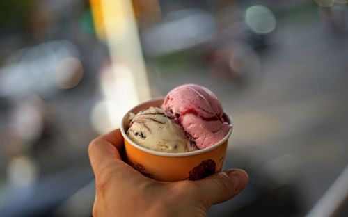 Midsection of person holding ice cream