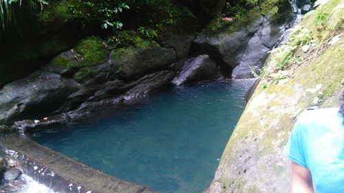 High angle view of river flowing through rocks