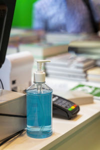 Close-up of hand sanitizer on table