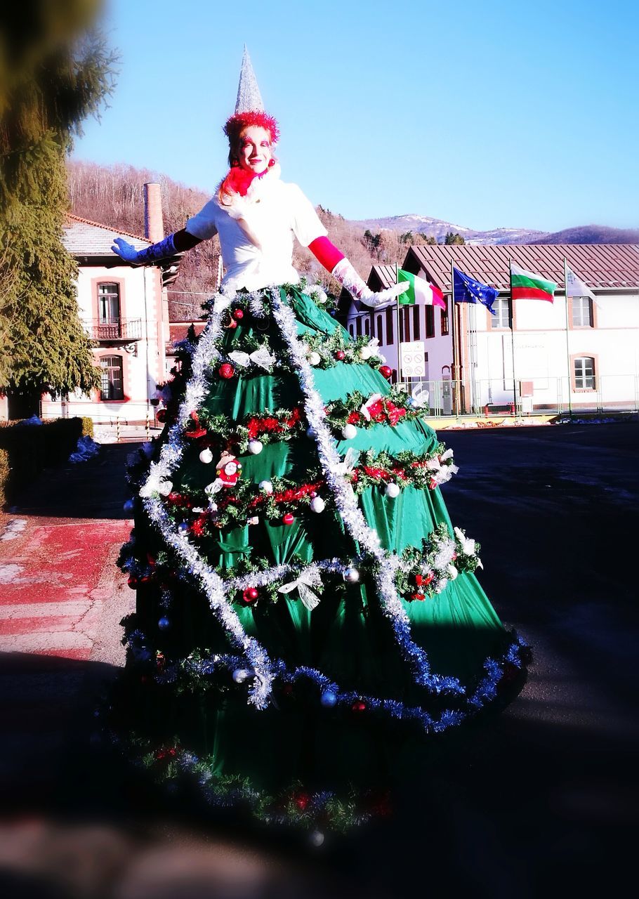 celebration, building exterior, christmas, christmas tree, architecture, christmas decoration, built structure, tree, tradition, celebration event, outdoors, no people, day, sky