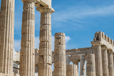 Close up view of the parthenon at the acropolis of athens. ancient markings can be seen on the ruins