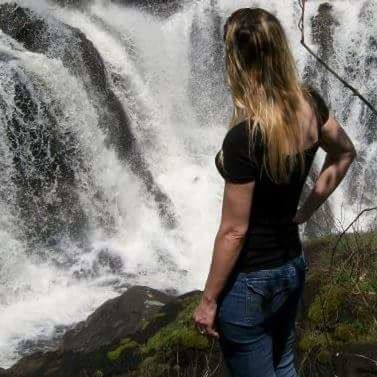 WOMAN STANDING IN WATER