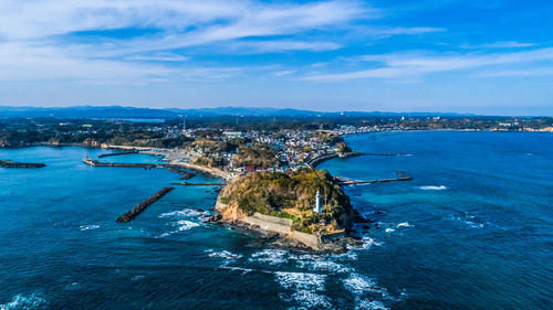 Scenic view of sea and buildings against sky