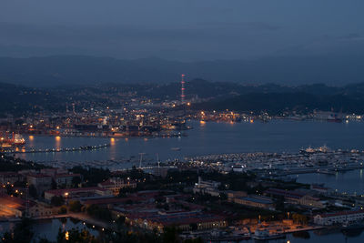 High angle view of illuminated city and buildings at night