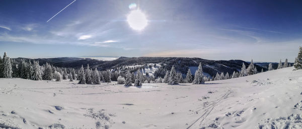 Scenic view of snow covered mountains against sky