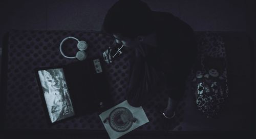 High angle view of woman holding table at home