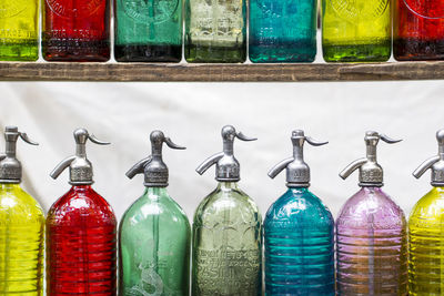 Close-up of multi colored bottles