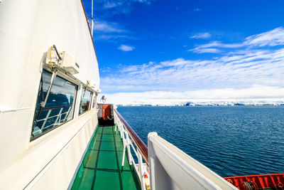 Ship sailing in sea against sky