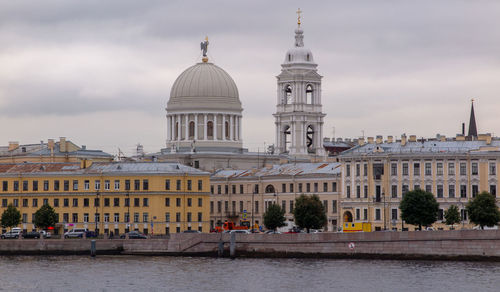 Buildings in city against sky
