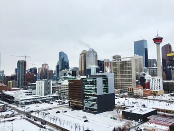 View of cityscape against sky during winter