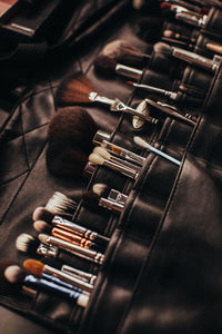 A set of makeup artist brushes in a black case