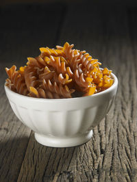 Close-up of fusilli pasta on table