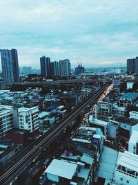 High angle view of buildings in city against sky