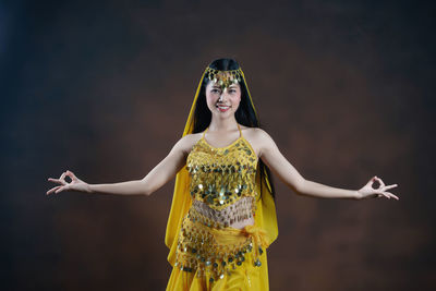 Portrait of young woman standing outdoors