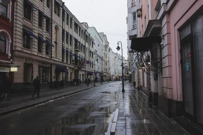 People walking on street in city