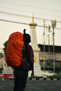 A man with backpack in yogyakarta icon